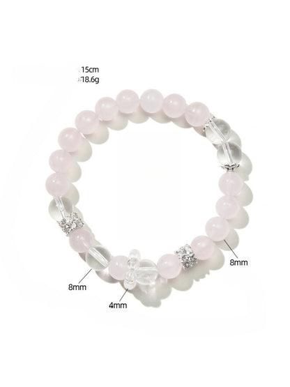 Lovra bracelet worn on wrist showcasing pink and white crystal beads