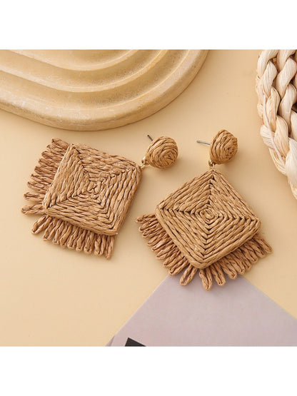 Side view of Earedge raffia square earrings showing texture and design