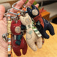 Vintage bear pendant keychain attached to a leather strap with metal ring