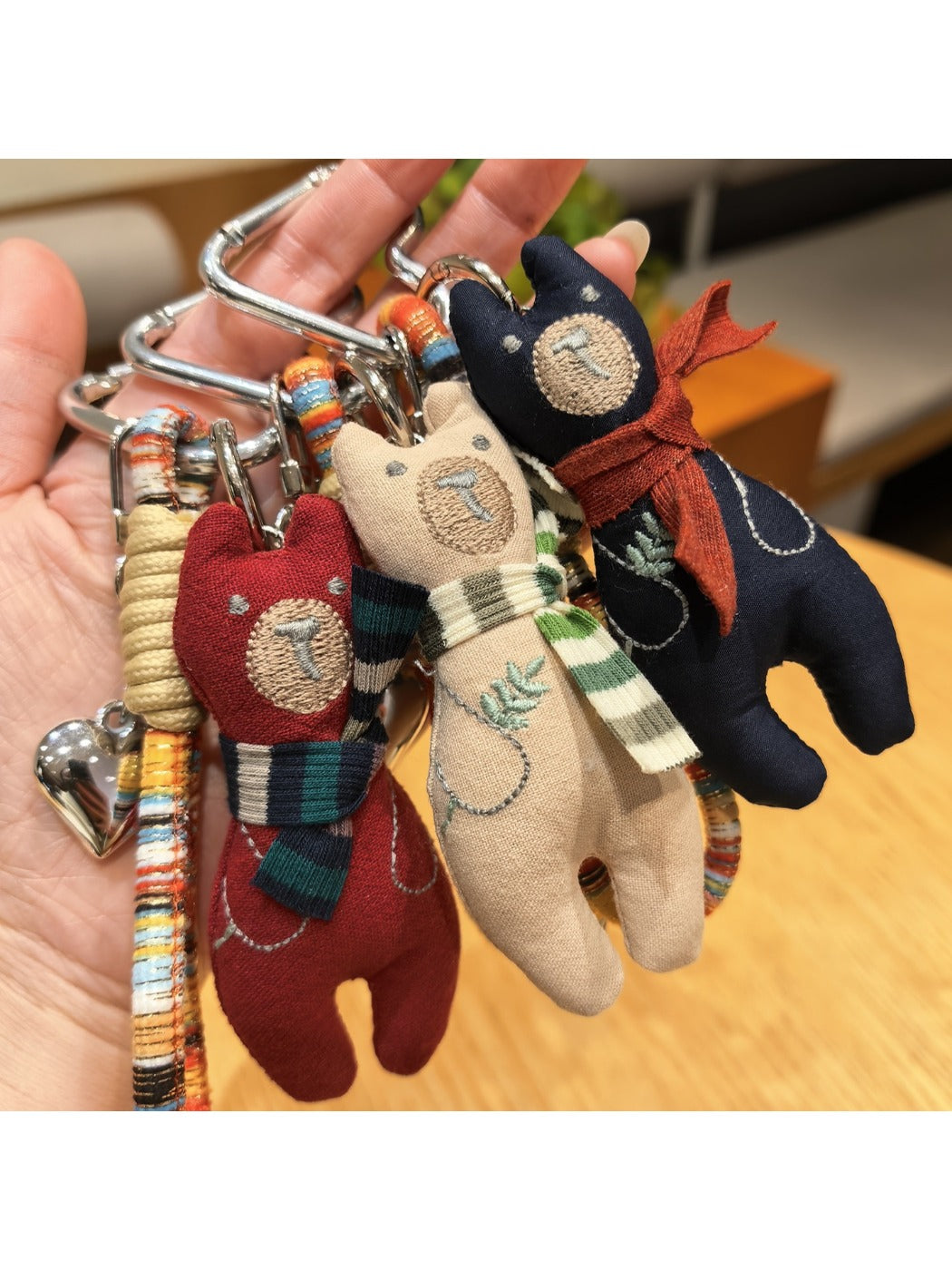 Vintage bear pendant keychain attached to a leather strap with metal ring
