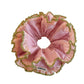 Pink double scrunchie with lace trim wrapped around a wrist