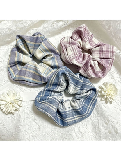 Close-up of Gifty simple vintage plaid scrunchie in beige and brown tones