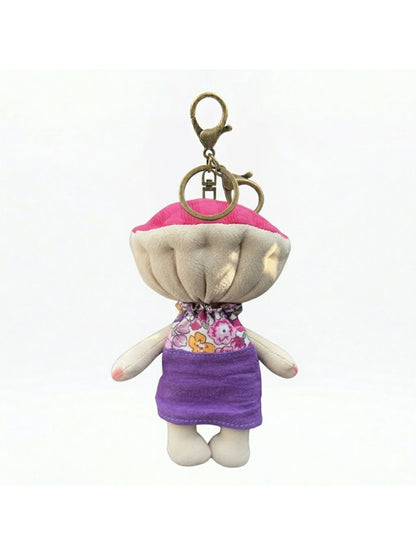 Keypus fabric doll keychain displayed alongside other accessories on a table