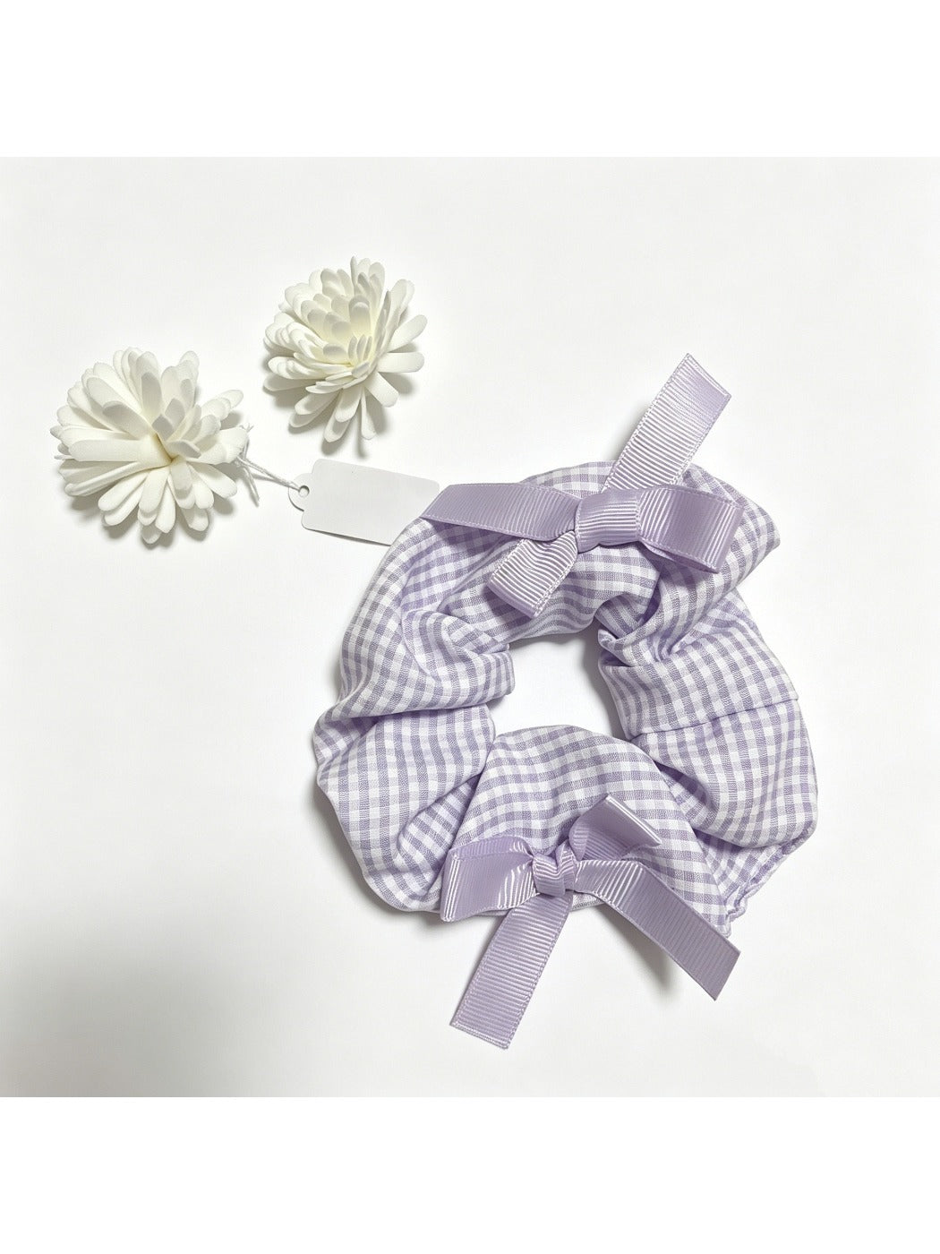 Gifty Sweet Bow Embellished Plaid Scrunchie worn on wrist with visible bow and plaid design