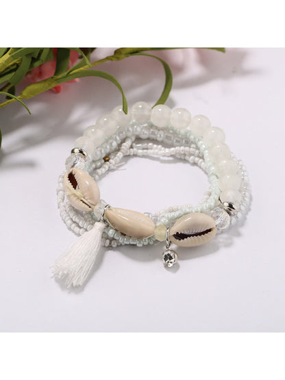 Lovra stackable bracelet worn on wrist with layered bohemian style beads