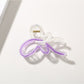 Beau butterfly hair clip styled in a half-up hairstyle