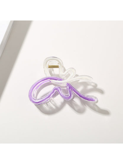 Beau butterfly hair clip styled in a half-up hairstyle