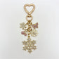 Close-up of snowflake pendant keychain highlighting fine metalwork details