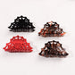 Four Halloween spiderweb hair claw colors