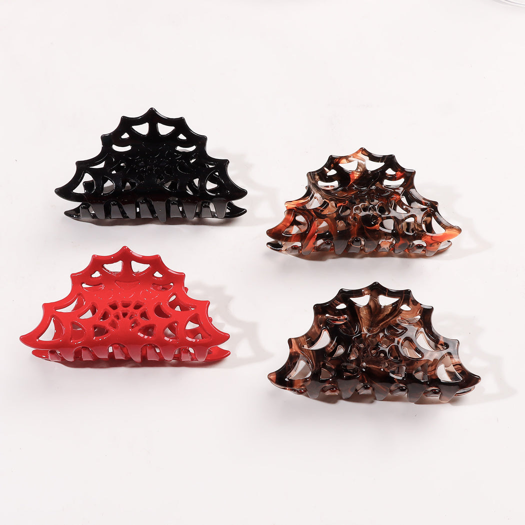 Four Halloween spiderweb hair claw colors