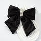 Black rhinestone bow spring hair clip