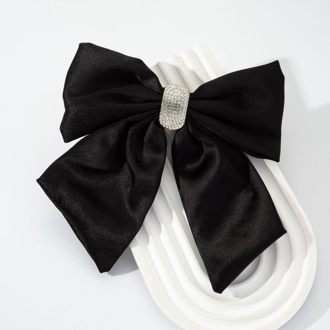 Black rhinestone bow spring hair clip