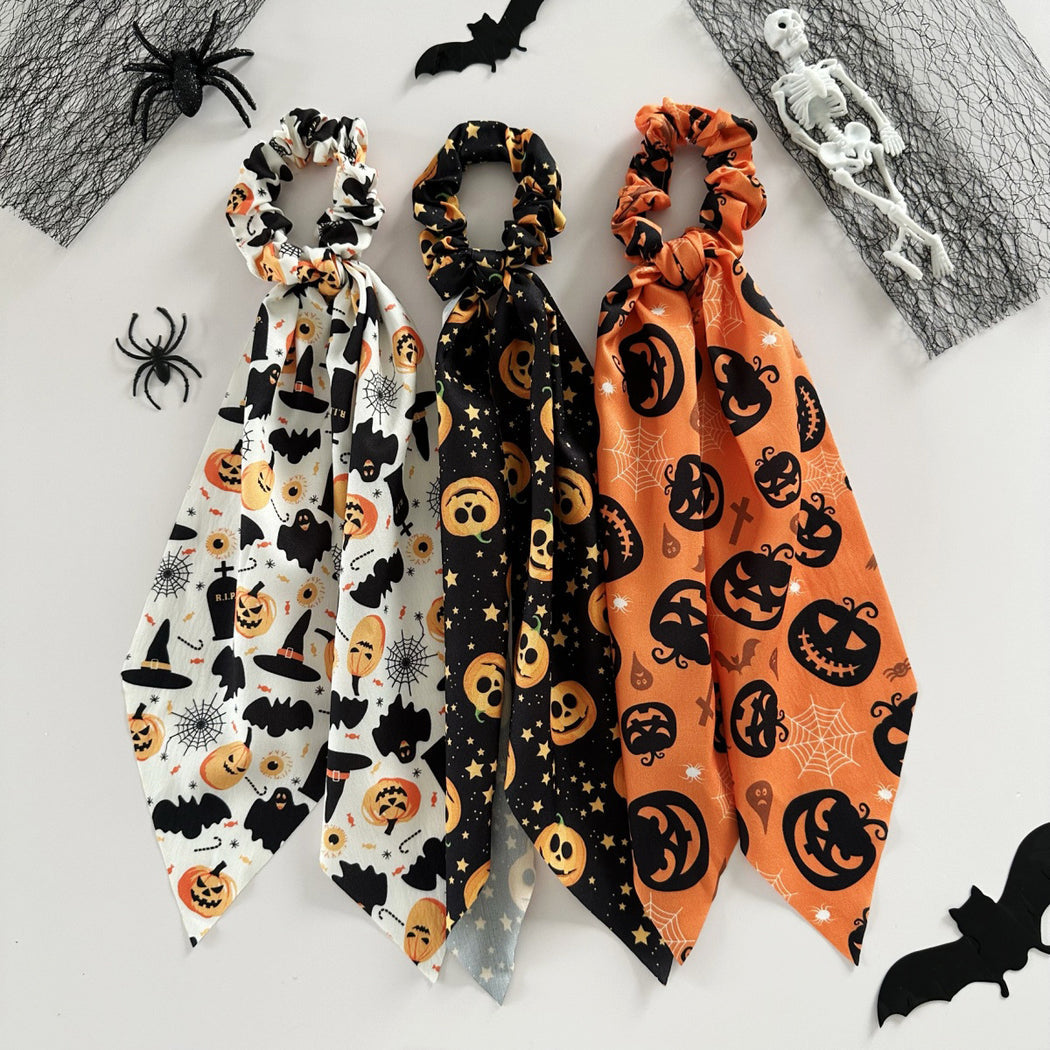 Three Halloween pumpkin ribbon scrunchies