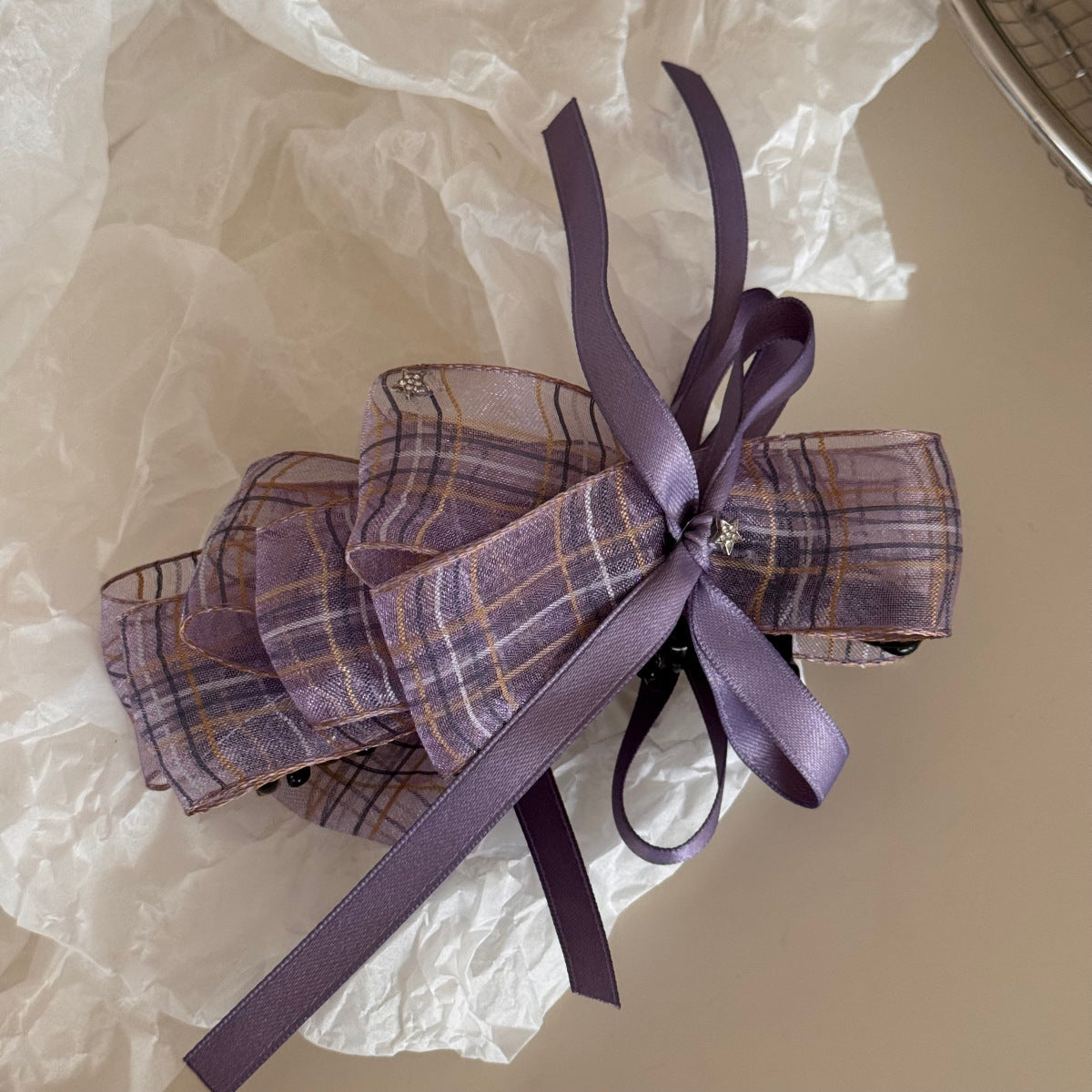 Side view of Beau checkered bow hair clip highlighting fabric texture and pattern