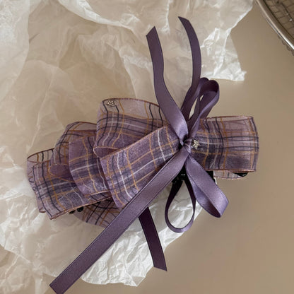 Side view of Beau checkered bow hair clip highlighting fabric texture and pattern