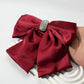 Rhinestone bow spring hair clip construction