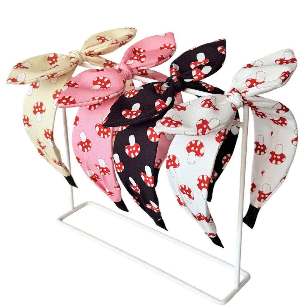 Four mushroom bow headbands on display