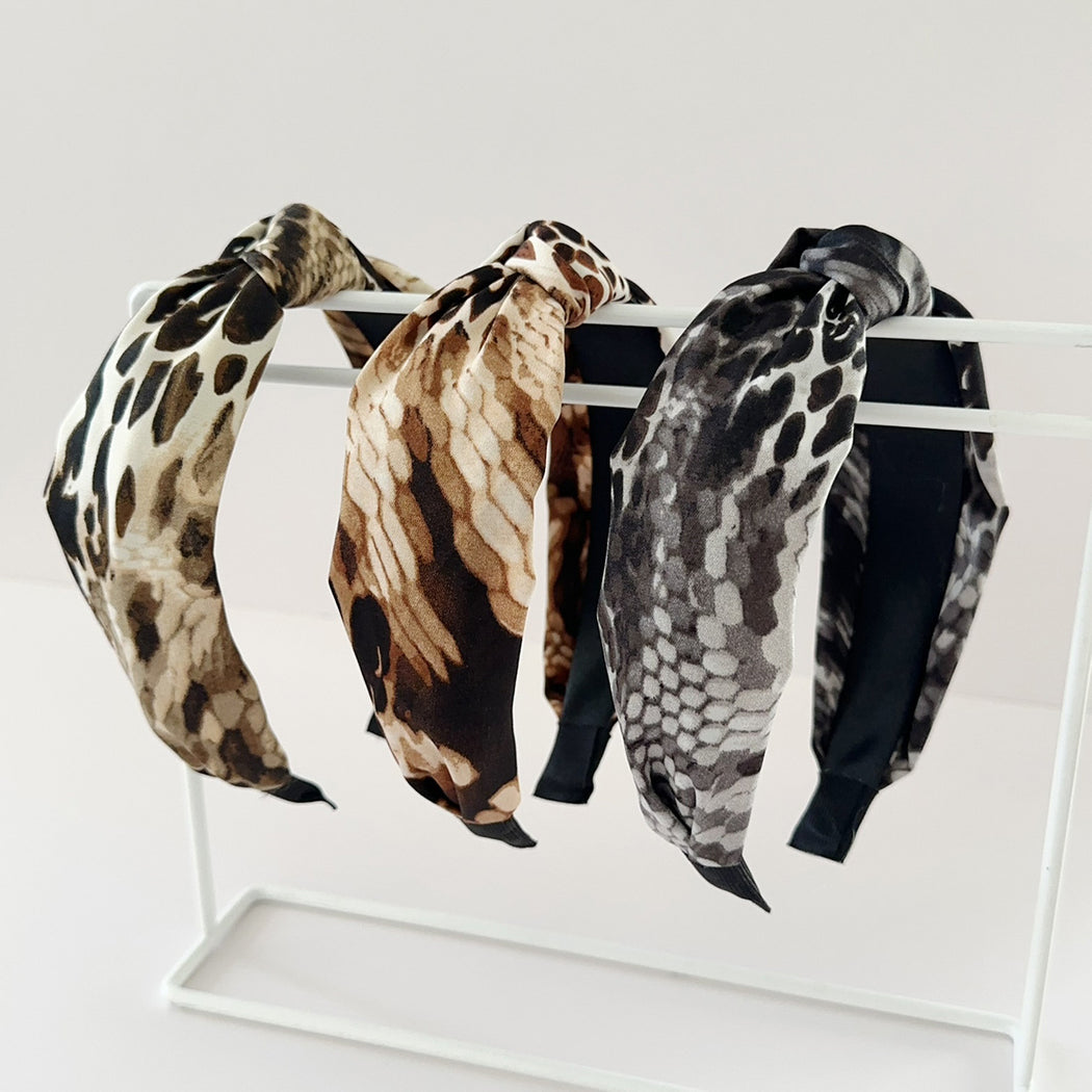 Three snakeskin crossed wide headbands