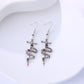 Earedge - Snake Wrapped Cross Drop Earrings