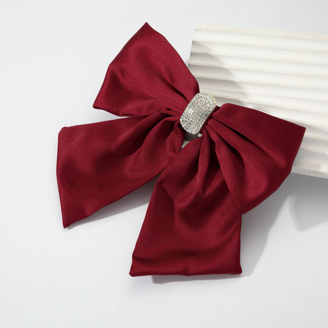 Burgundy rhinestone bow spring hair clip