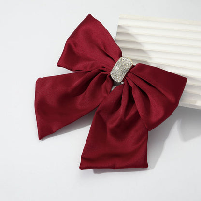 Burgundy rhinestone bow spring hair clip