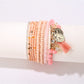 Lovra bracelet laid flat showing full length with tassel pendant