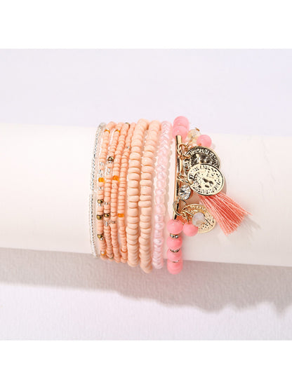 Lovra bracelet laid flat showing full length with tassel pendant