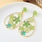 Earedge floral raffia earrings shown from the back to display clasp details