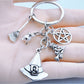 Close-up of silver alloy witch hat keychain with detailed broom charm