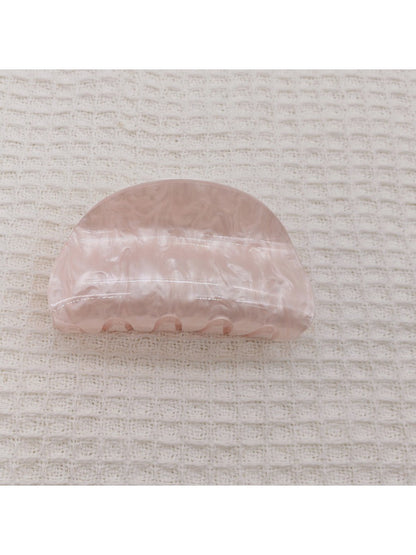 Beau marble pattern claw clip open to show inner clasp and teeth
