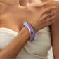 Lovra irregular shaped bangle bracelet photographed from above