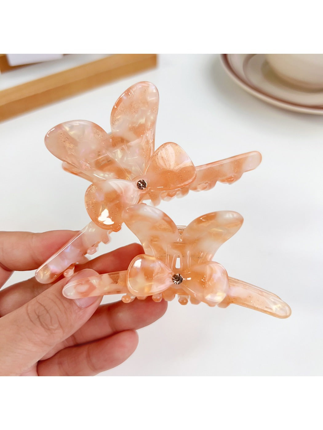 Side view of Beau bow adorned hair claw clip highlighting curved teeth