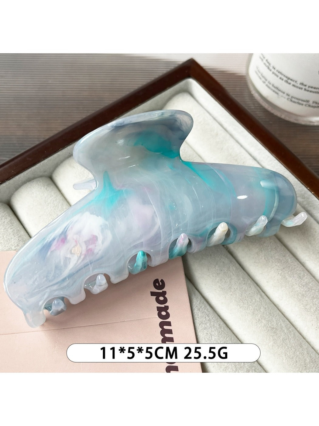 Beau plastic updo claw clip shown from above, highlighting its oval shape