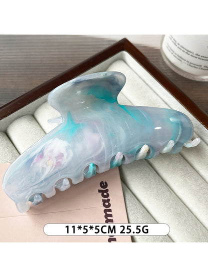 Beau plastic updo claw clip shown from above, highlighting its oval shape