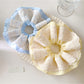 Gifty chic minimalist scrunchie with beige and brown color block design on white background