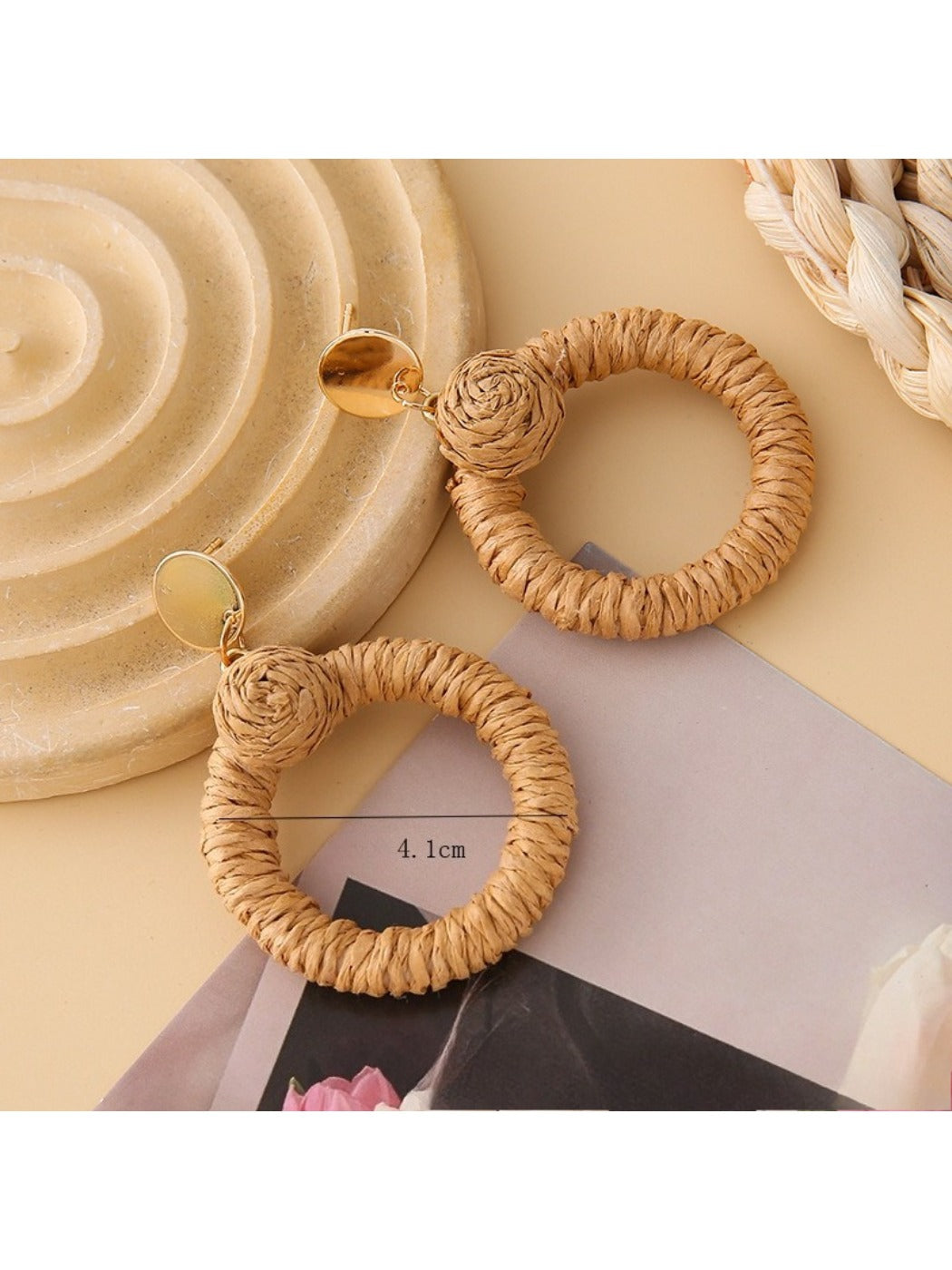 Earedge rattan round hollow earrings held in hand showing size and detail