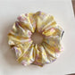 Colorful scrunchies with oil painting inspired abstract patterns on fabric