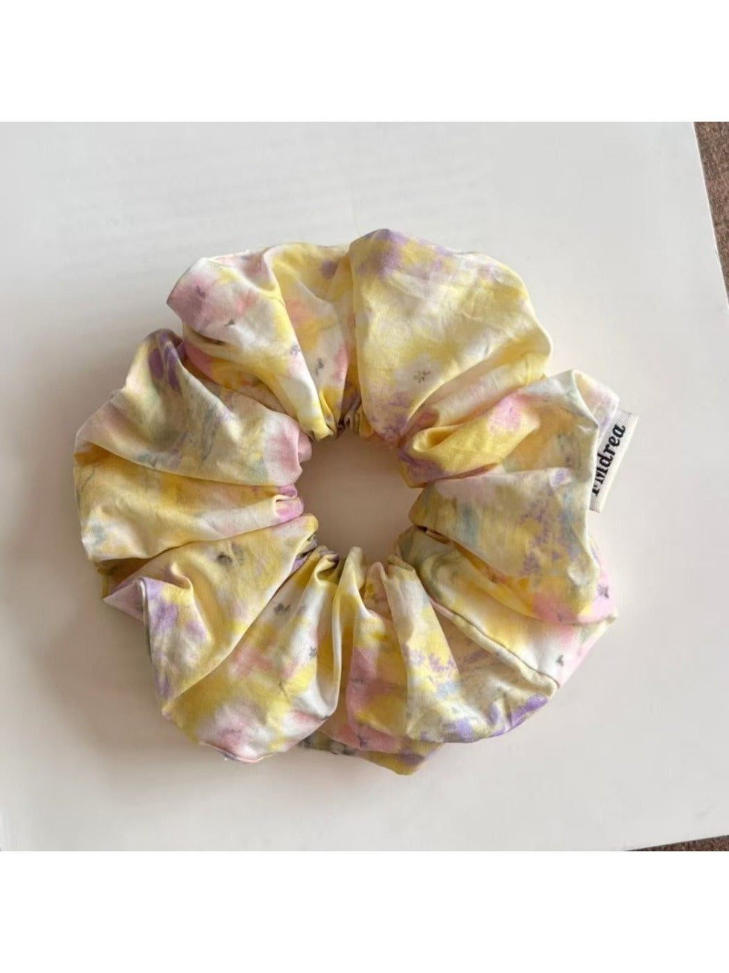 Colorful scrunchies with oil painting inspired abstract patterns on fabric