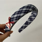 Blue headband worn on a mannequin head showing fit and style