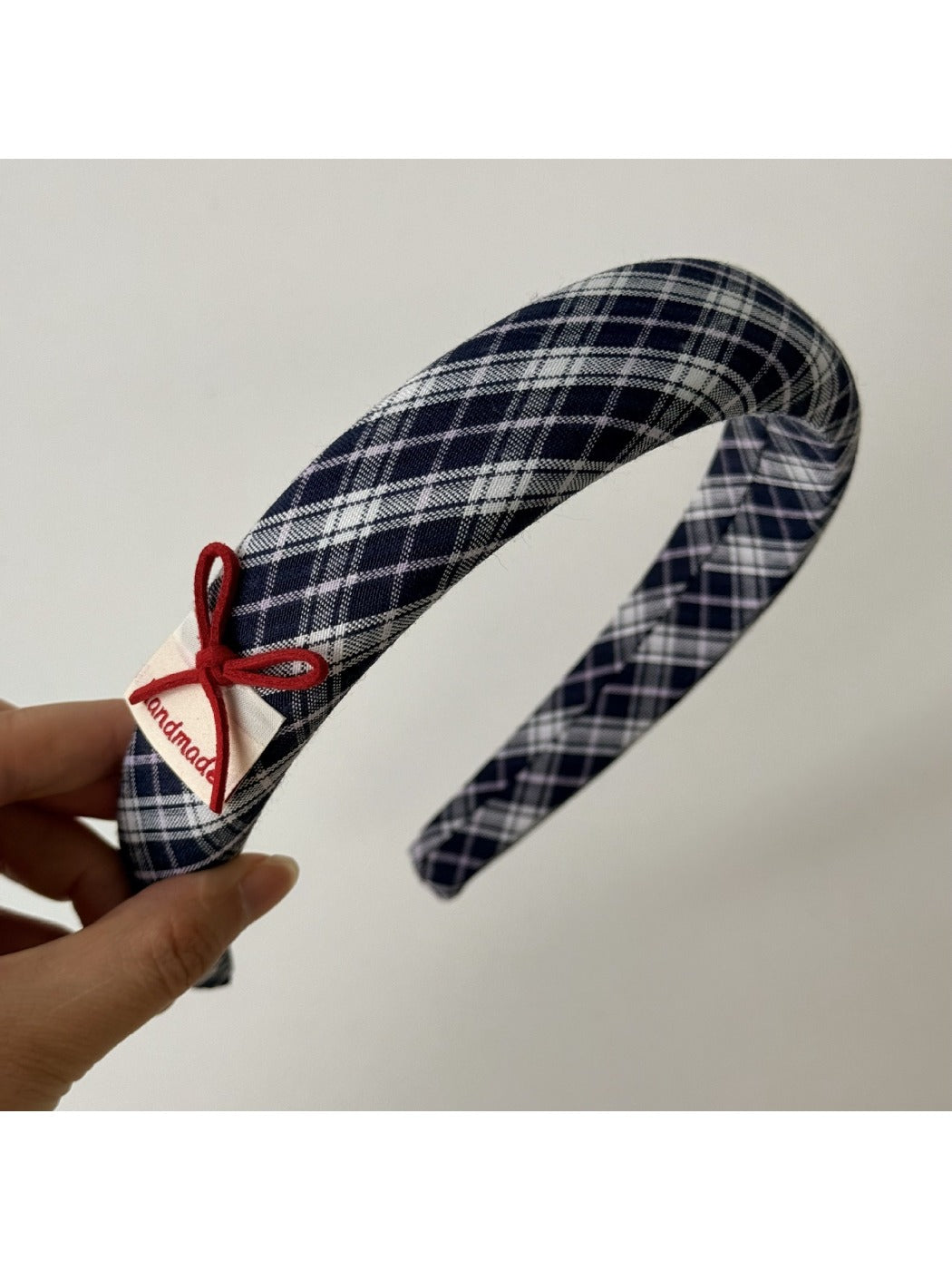 Blue headband worn on a mannequin head showing fit and style
