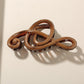 Beau - Glossy PS Curved Hollow Design Claw Clip