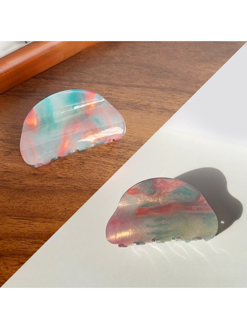 Beau colorful hair claw clip placed on wooden surface