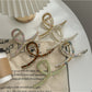 Beau large size acetate claw clip in tortoiseshell pattern on white background