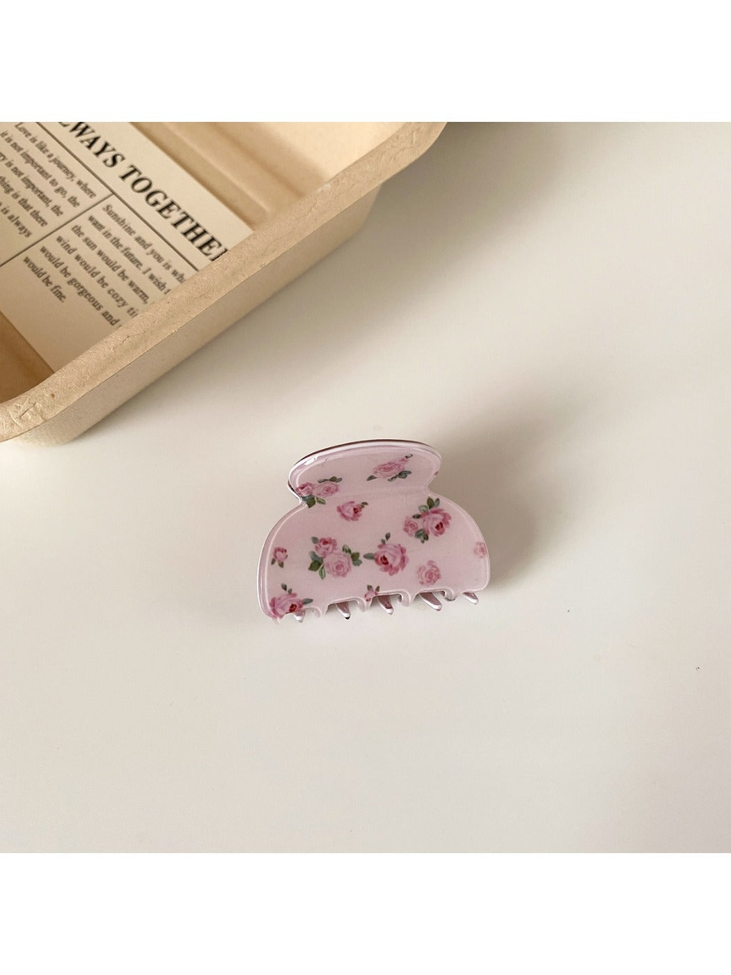 Beau pink rose print hair claw clip styled in hair from side angle