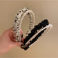 Side view of creative vintage tulle headband showing textured layers and bow