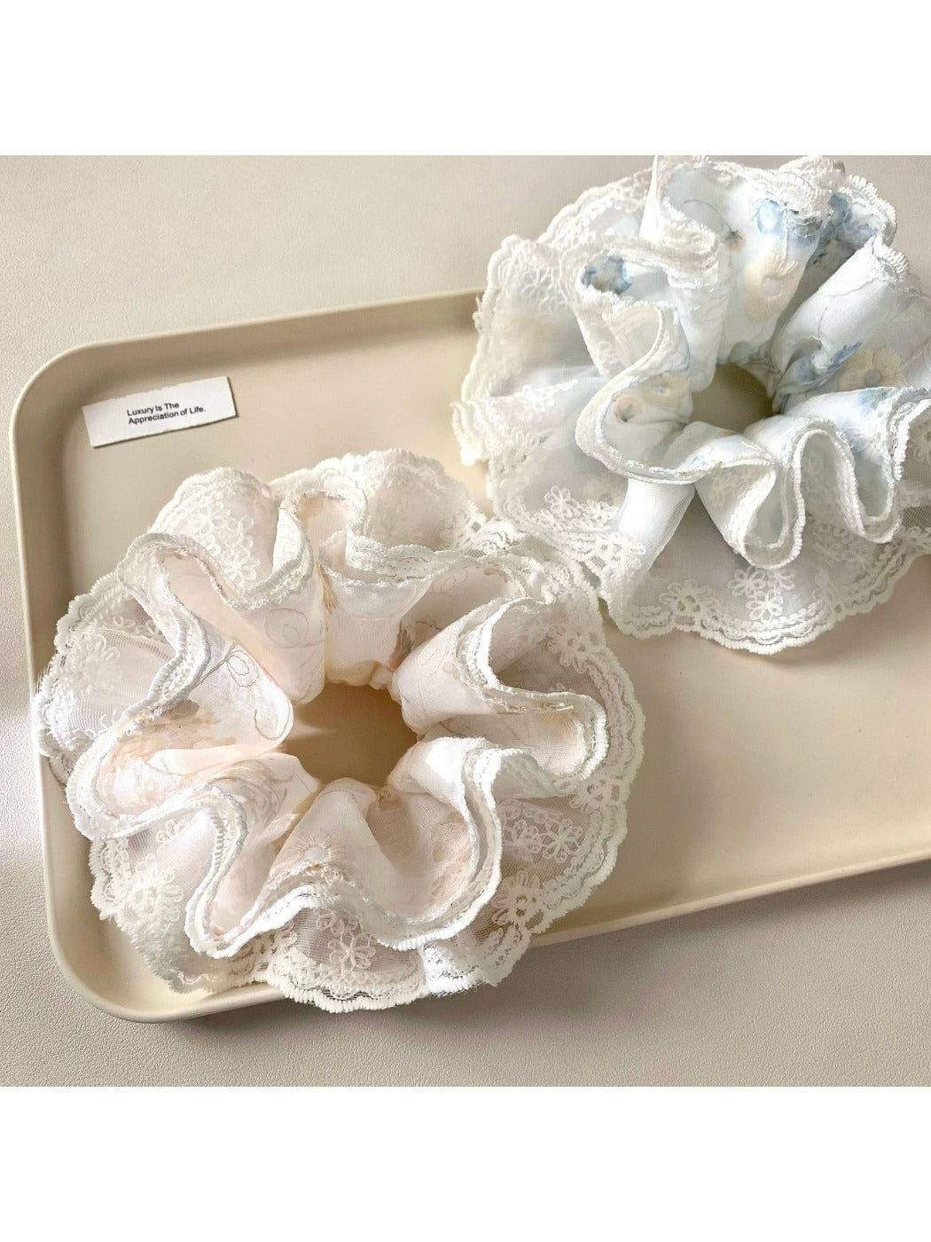 Gifty minimalist modern scrunchie with abstract black and white print on fabric