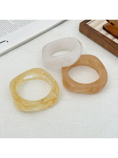 Close-up of Lovra bangle bracelet highlighting its unique irregular shape and smooth finish