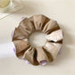 Vintage yellow ruffle scrunchie packaged in a clear plastic bag