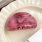 Beau hair claw clip with pink ombre gradient displayed next to matching accessories