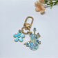 Keypus alloy flower harp keychain attached to a set of keys